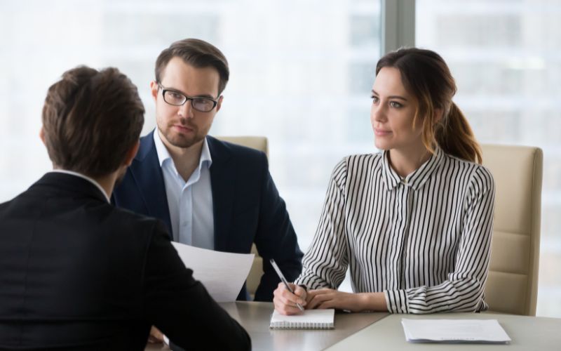 company-outplacement-support HR professional reviewing outplacement assistance options for laid-off employees