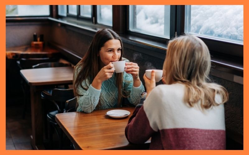 Two professionals having a coffee chat to build networking connections